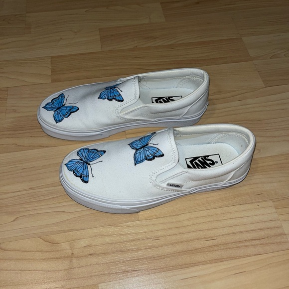 White slip on vans with painted on blue butterflies - Picture 1 of 4
